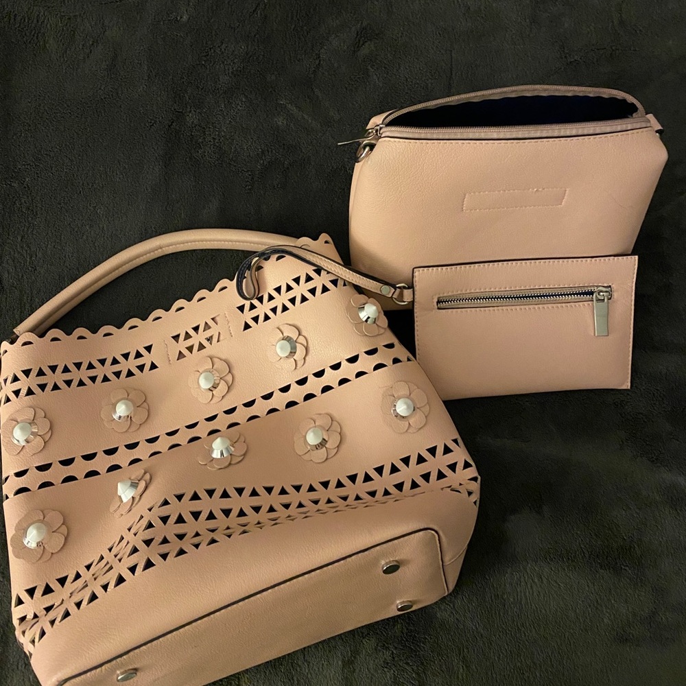 Spring purse with makeup bag and wristlet.